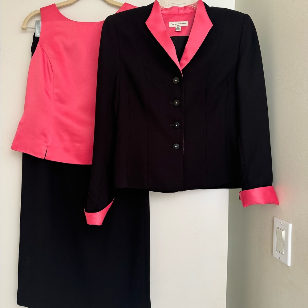 Amanda Smith black 3 piece suit with pink top and accents.